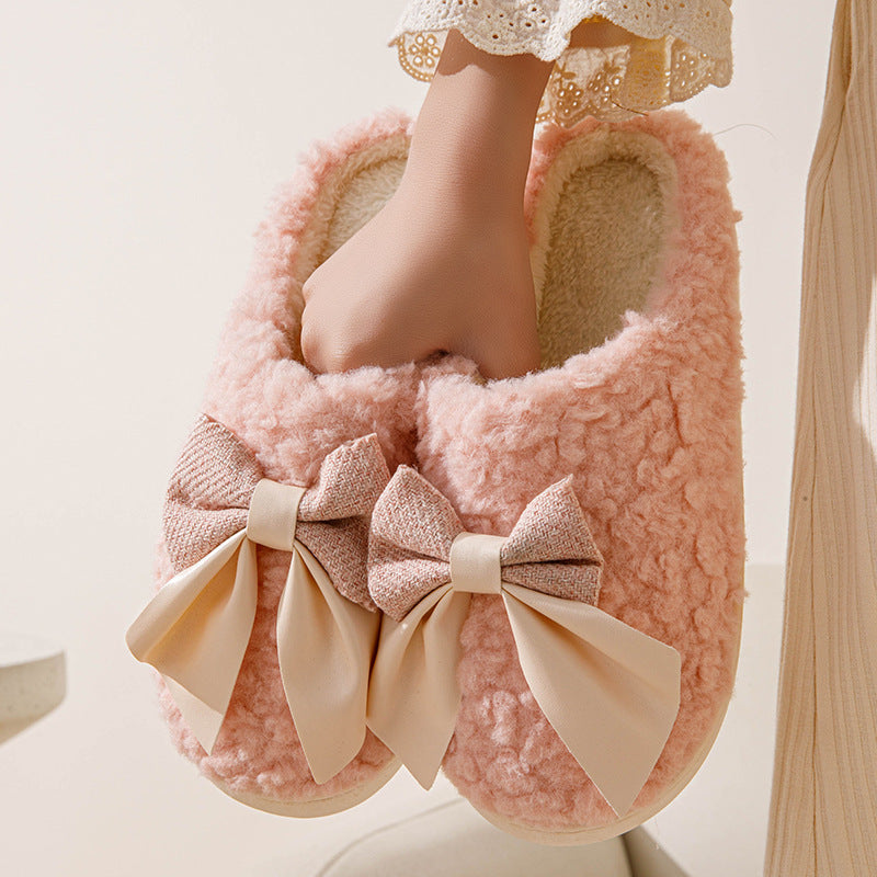 Pantofole con fiocco calde,morbide, in peluche.